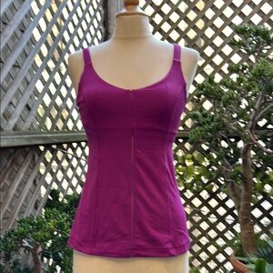 Lululemon Women's Purple Tank Top. Size 6 multiple back straps.  Shelf bra.
GUC